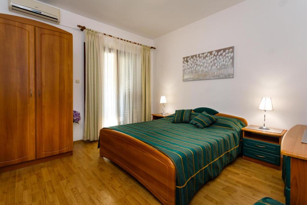 Postel nebo postele na pokoji v ubytování Rooms Mimi