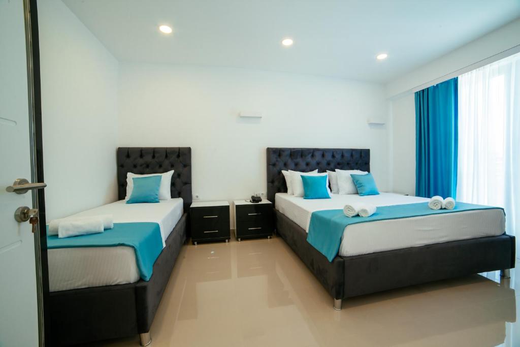 Postel nebo postele na pokoji v ubytování Hotel Ambiente Ulcinj