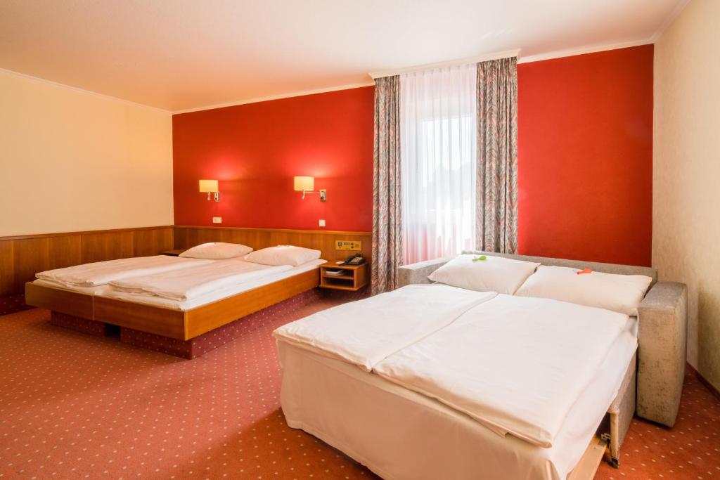 Postel nebo postele na pokoji v ubytování Ringhotel Reubel