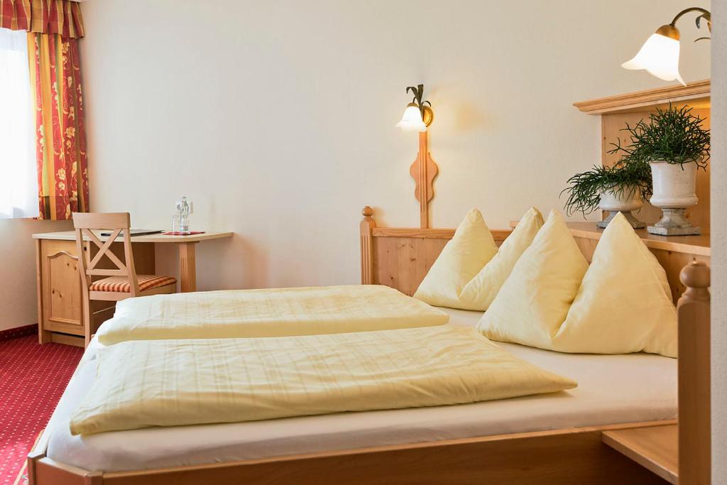 Postel nebo postele na pokoji v ubytování Landhotel Untermüllnergut