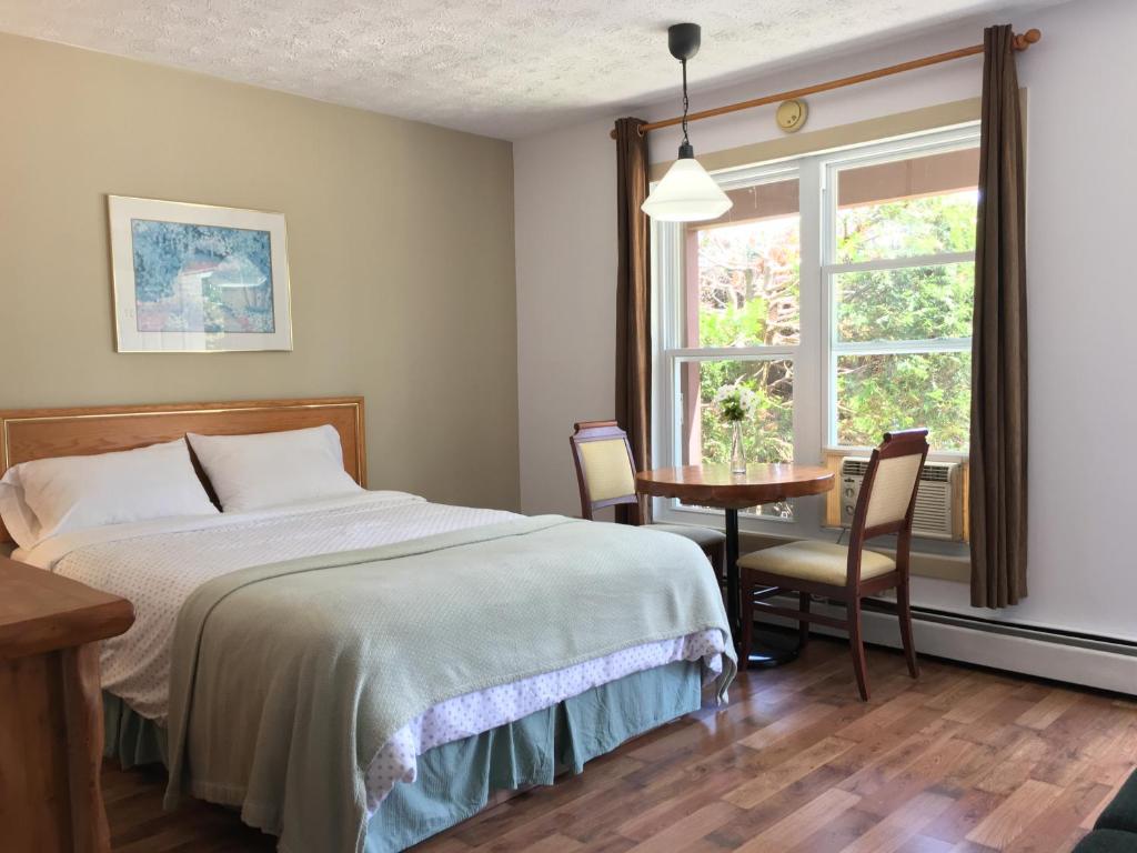 Postel nebo postele na pokoji v ubytování Motel le Sabre