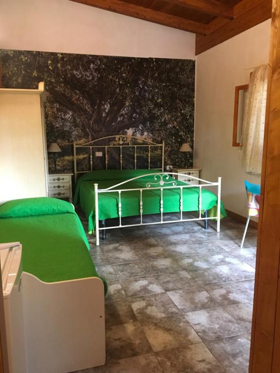 Postel nebo postele na pokoji v ubytování B&B Villa Carla