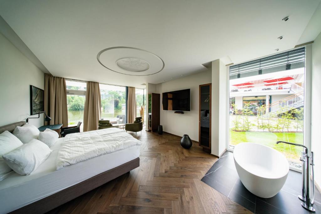 Postel nebo postele na pokoji v ubytování MotelplusHotel BiggeSeeFront