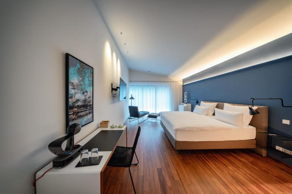 Postel nebo postele na pokoji v ubytování MotelplusHotel BiggeSeeFront
