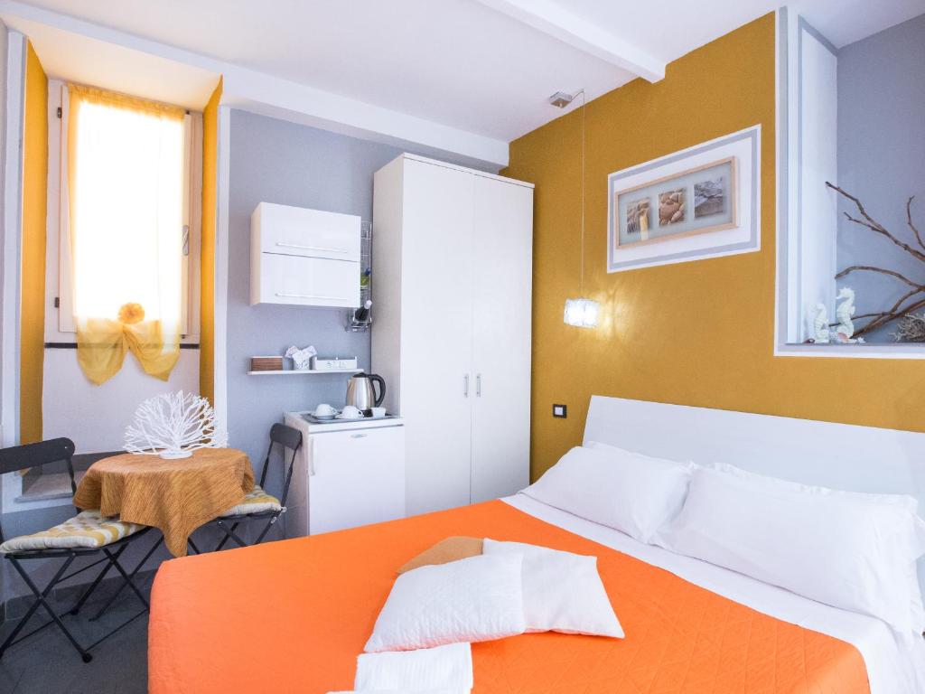 Postel nebo postele na pokoji v ubytování I Coralli rooms & apartments