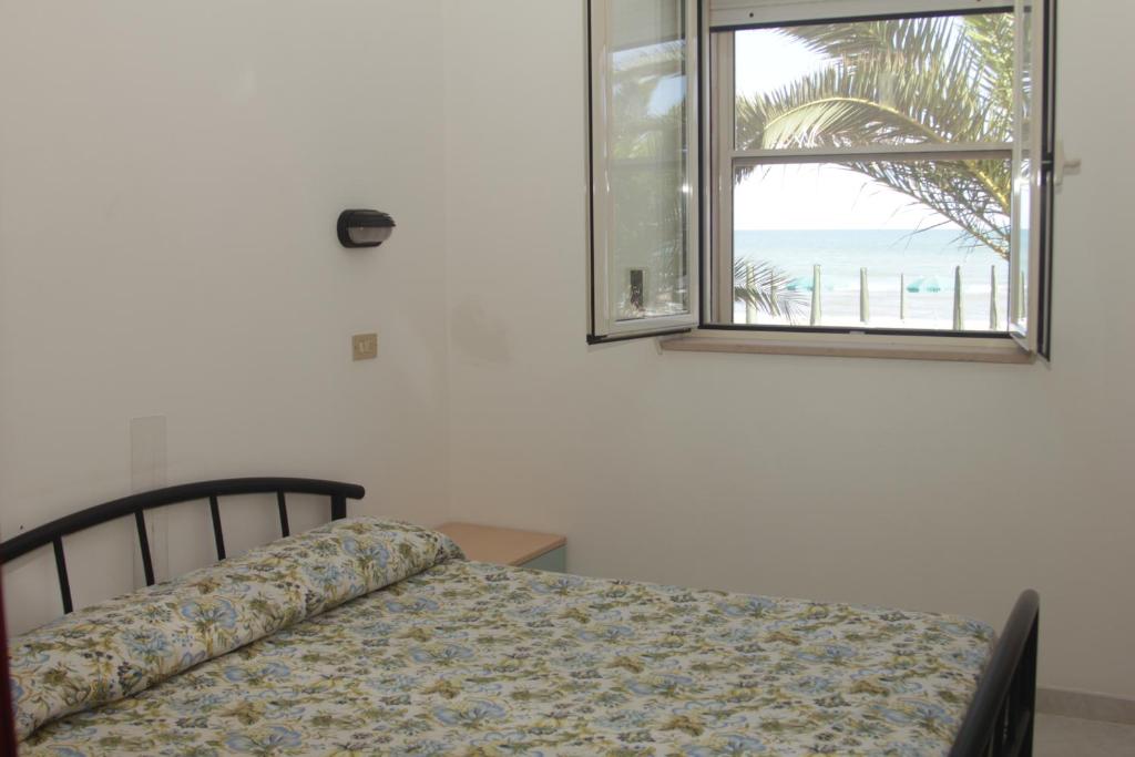Llit o llits en una habitació de Albergo 2 Pini