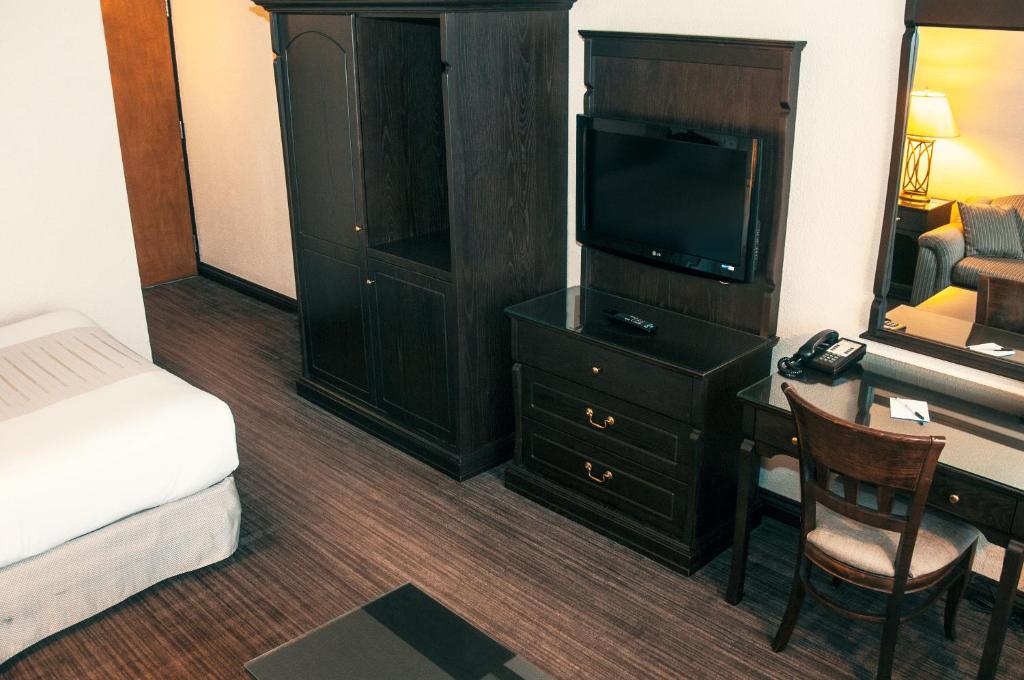 Postel nebo postele na pokoji v ubytování Hotel Le Montagnais