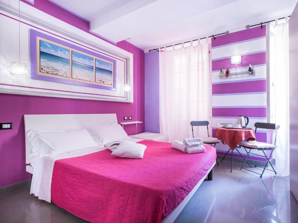Postel nebo postele na pokoji v ubytování I Coralli rooms & apartments