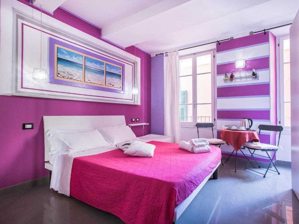 Postel nebo postele na pokoji v ubytování I Coralli rooms & apartments