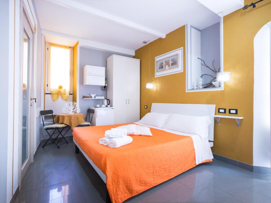 Postel nebo postele na pokoji v ubytování I Coralli rooms & apartments