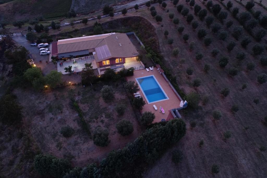 an aerial view of a house with a swimming pool at Agriturismo Colle del Sindaco in Petrizia