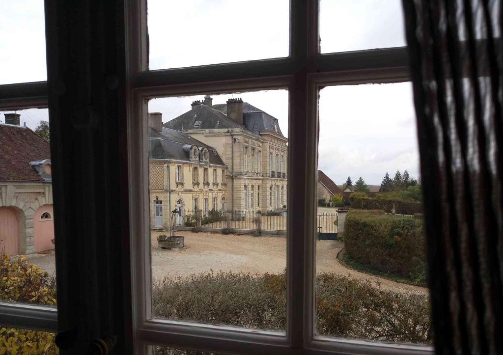 a view from a window of a large building at Gîte Design in Arceau