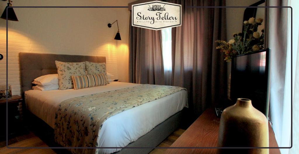 Postel nebo postele na pokoji v ubytování Storytellers Villas