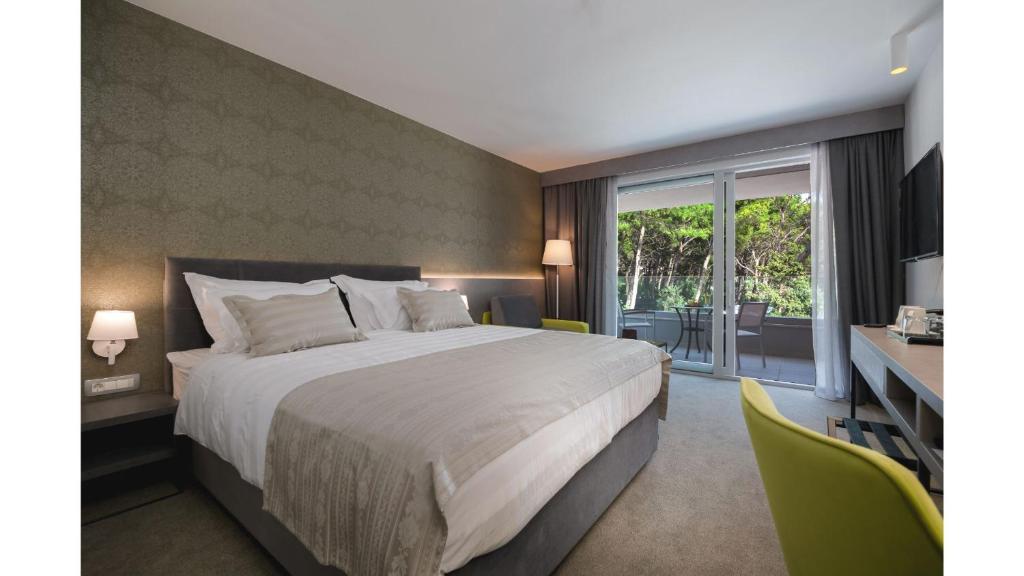 Postel nebo postele na pokoji v ubytování Boutique Hotel Mirjam