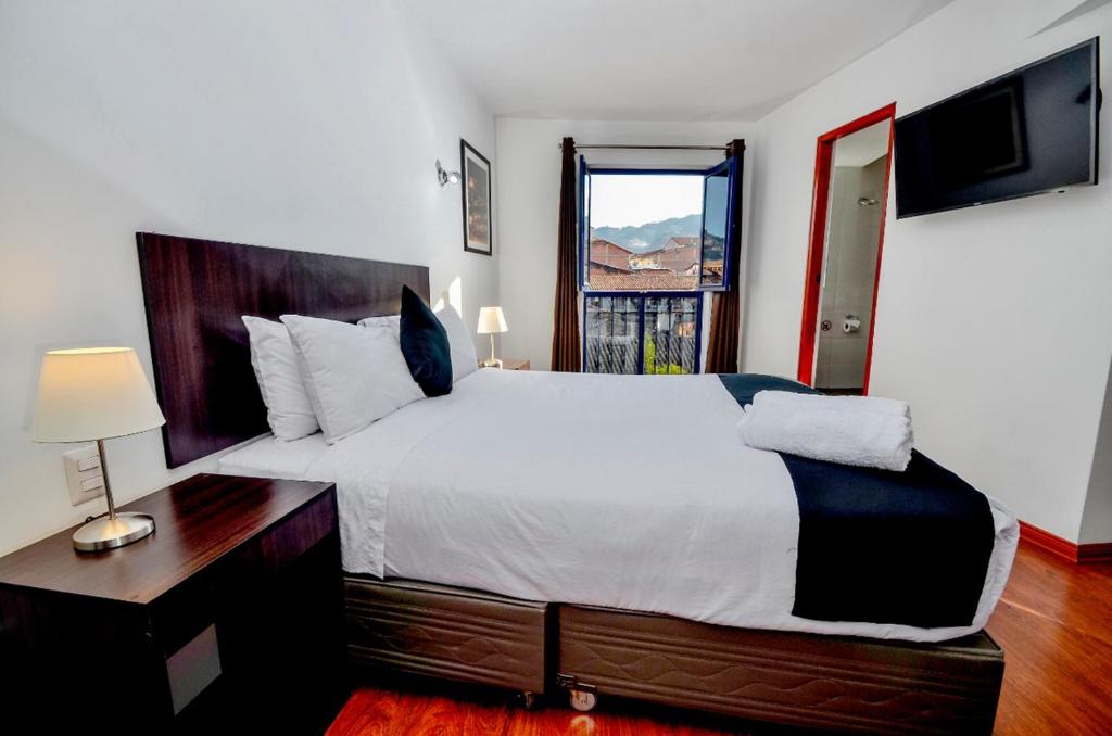 Postel nebo postele na pokoji v ubytování Ankawa Hotel Boutique