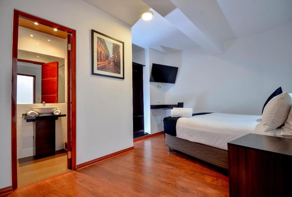 Postel nebo postele na pokoji v ubytování Ankawa Hotel Boutique