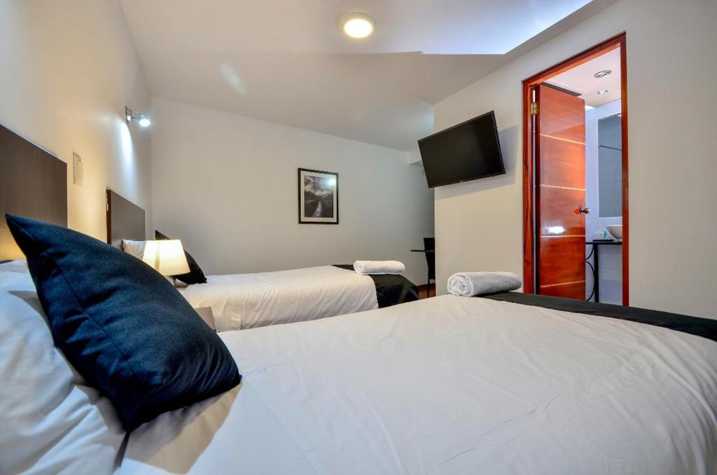 Postel nebo postele na pokoji v ubytování Ankawa Hotel Boutique