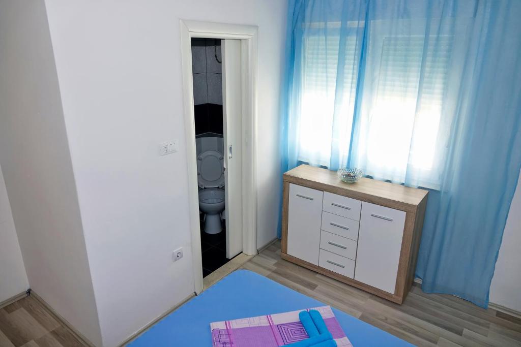 Postel nebo postele na pokoji v ubytování Lux Dalmatia I & R