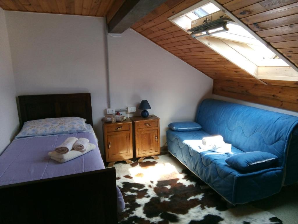 Postel nebo postele na pokoji v ubytování B&B PRA' DEI CERVI