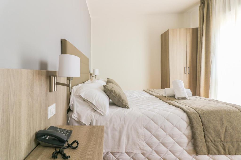 Postel nebo postele na pokoji v ubytování Hotel Loreley
