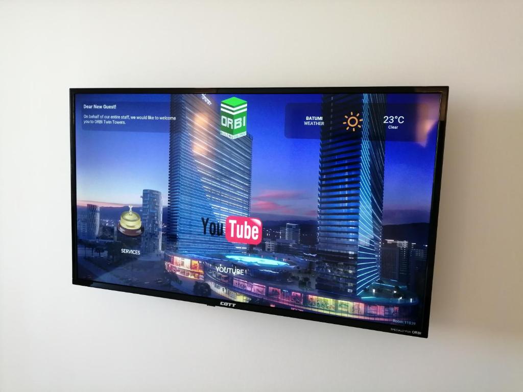 TV a/nebo společenská místnost v ubytování Lamar hotel