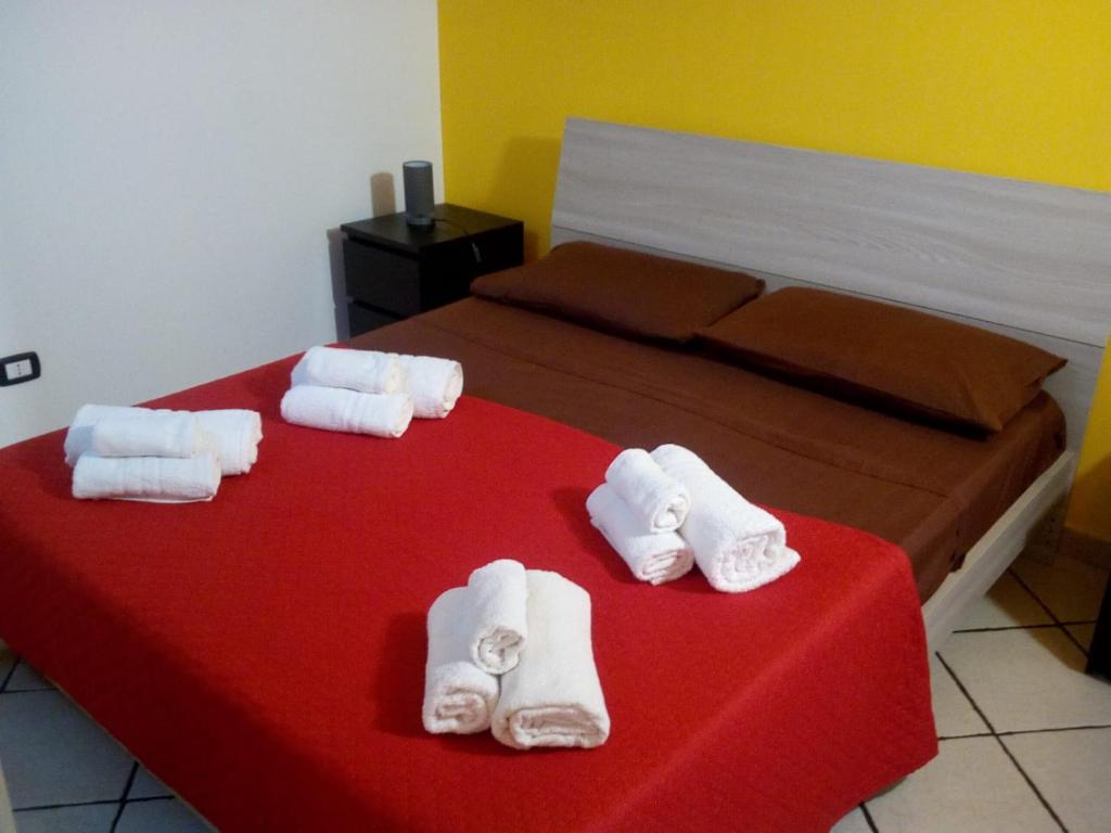 a hotel room with towels on a bed at Il Fortino in Catania