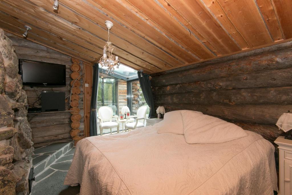 Postel nebo postele na pokoji v ubytování Ankkalinna