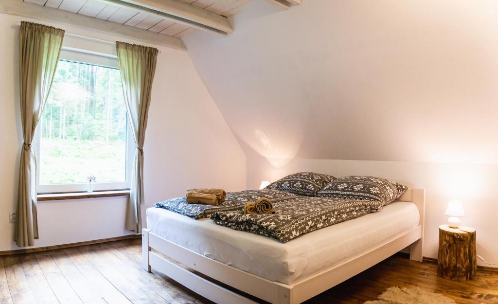 Postel nebo postele na pokoji v ubytování Chata Kamenie