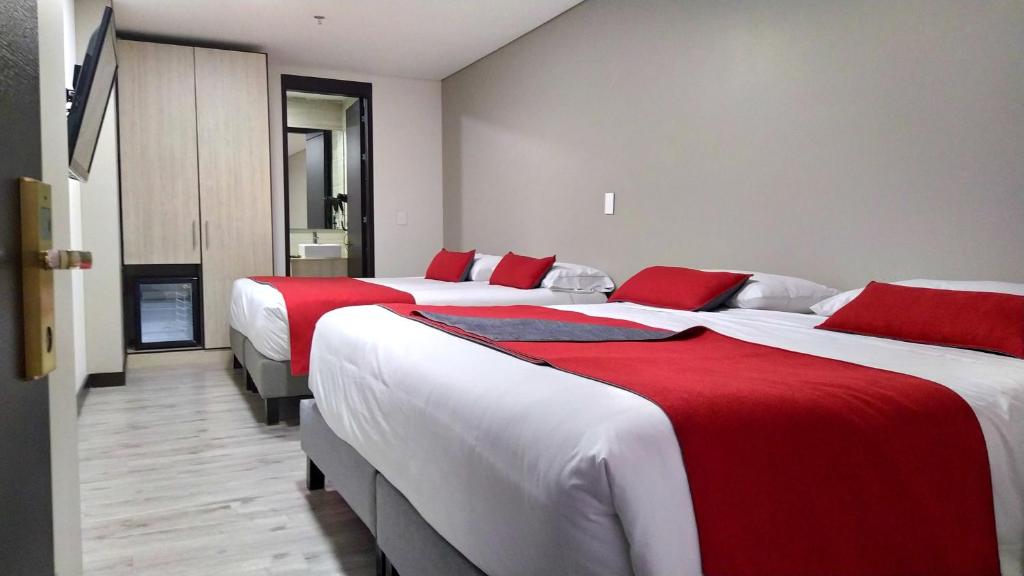 Postel nebo postele na pokoji v ubytování Hotel WLH Silver Corferias