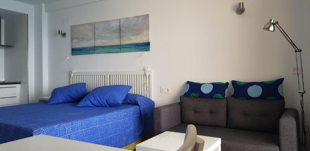Posteľ alebo postele v izbe v ubytovaní Apartamentos Chinasolymar