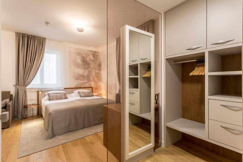 Postel nebo postele na pokoji v ubytování Residence Stine