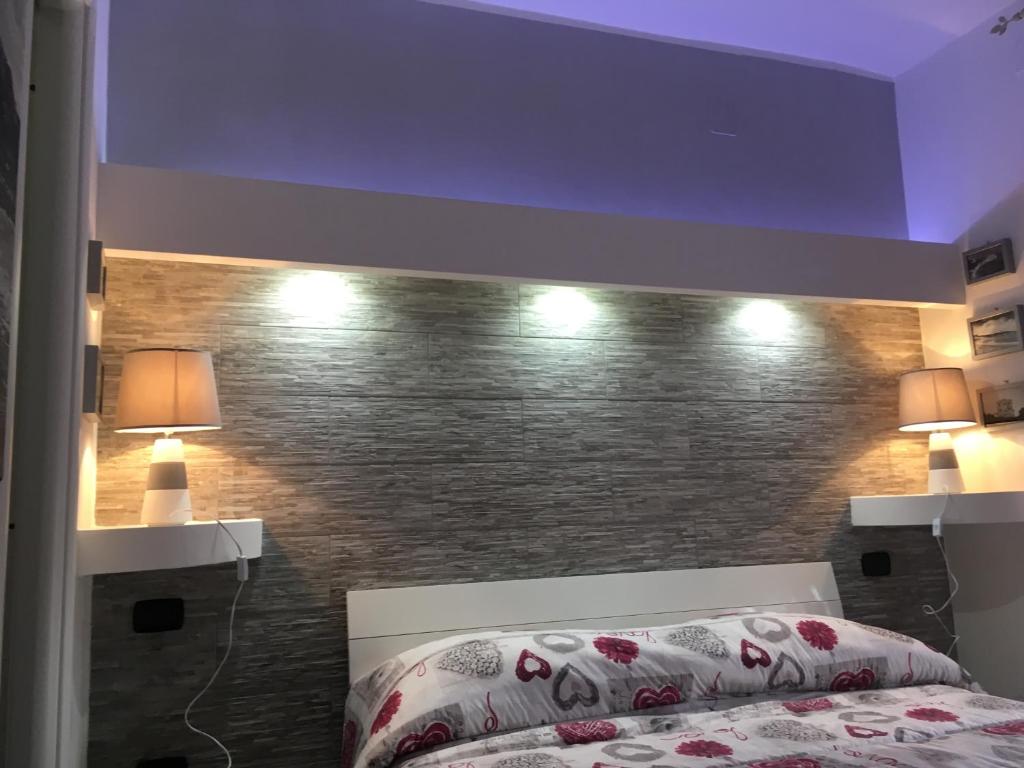 Postel nebo postele na pokoji v ubytování Re Mare B&B