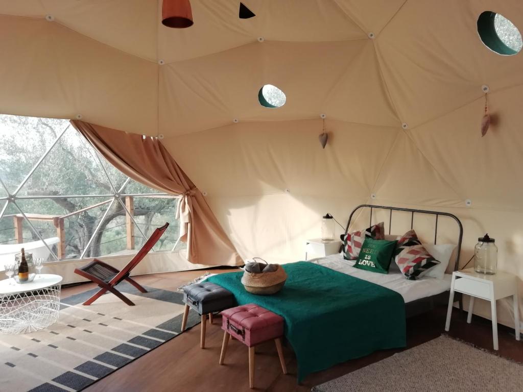 a bedroom with a bed in a tent at Cerchio Del Desiderio Glamping Retreat in Pescara