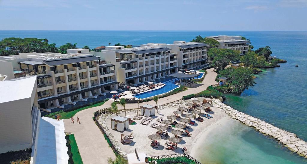 an aerial view of a resort with a swimming pool at Hideaway at Royalton Negril, An Autograph Collection All-Inclusive Resort - Adults Only in Negril