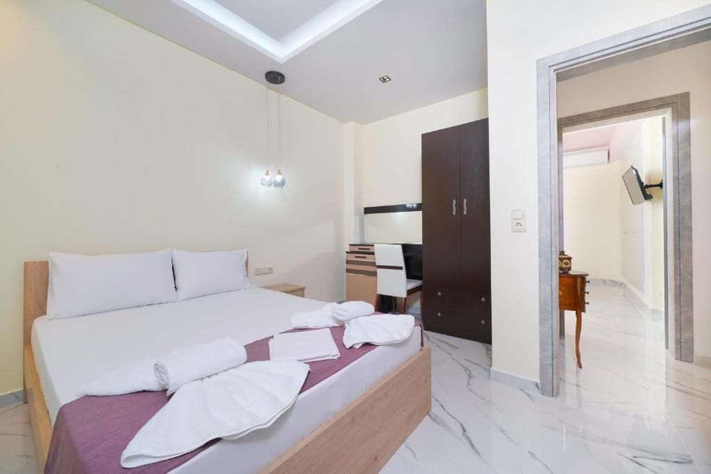 Postel nebo postele na pokoji v ubytování Eridon Suites