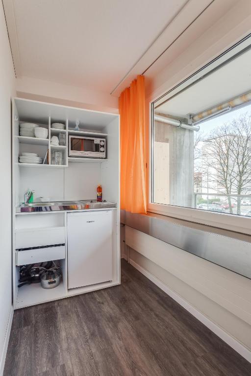 Kuchyň nebo kuchyňský kout v ubytování Anstatthotel Zug - self-check-in