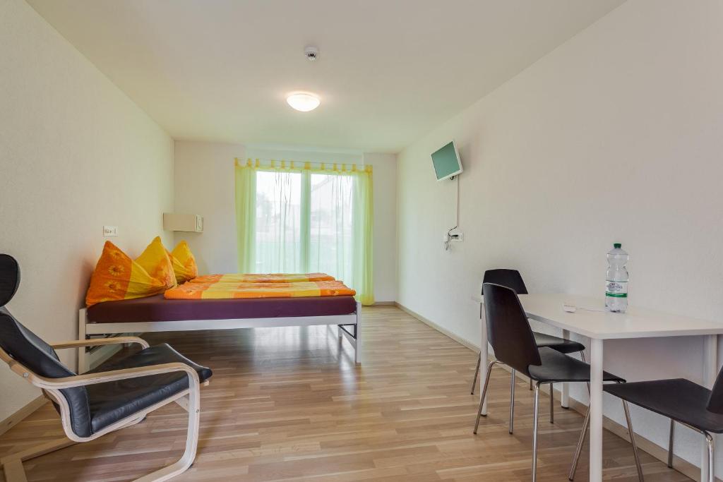 Postel nebo postele na pokoji v ubytování Anstatthotel Hochdorf - self-check-in