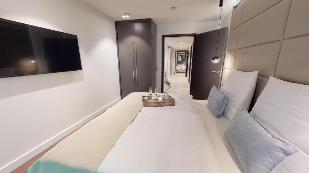 Postel nebo postele na pokoji v ubytování White Pearl Appartment 1.07