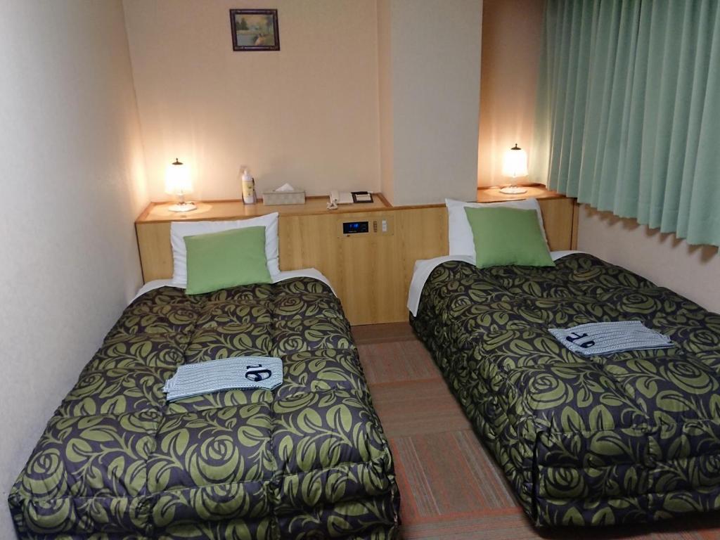 Postel nebo postele na pokoji v ubytování Hotel A.P