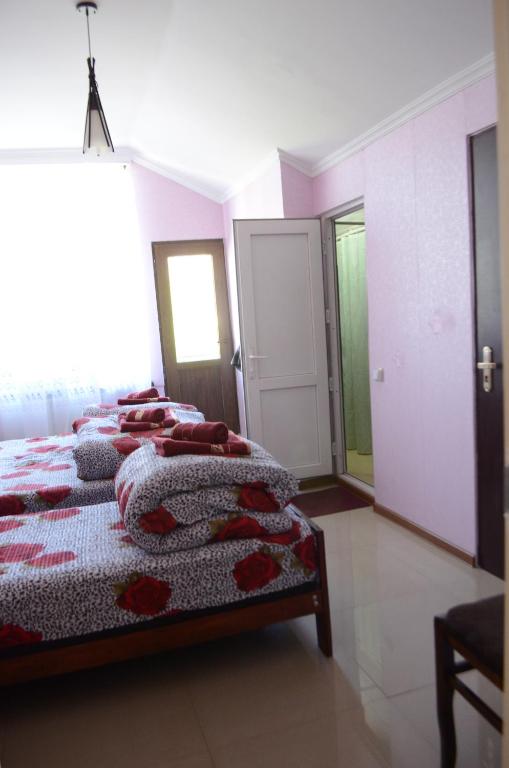 Postel nebo postele na pokoji v ubytování Alex's Cosy Guesthouse