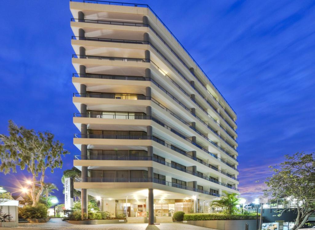 a rendering of the apartment building at dusk at Summit Apartments Brisbane City in Brisbane
