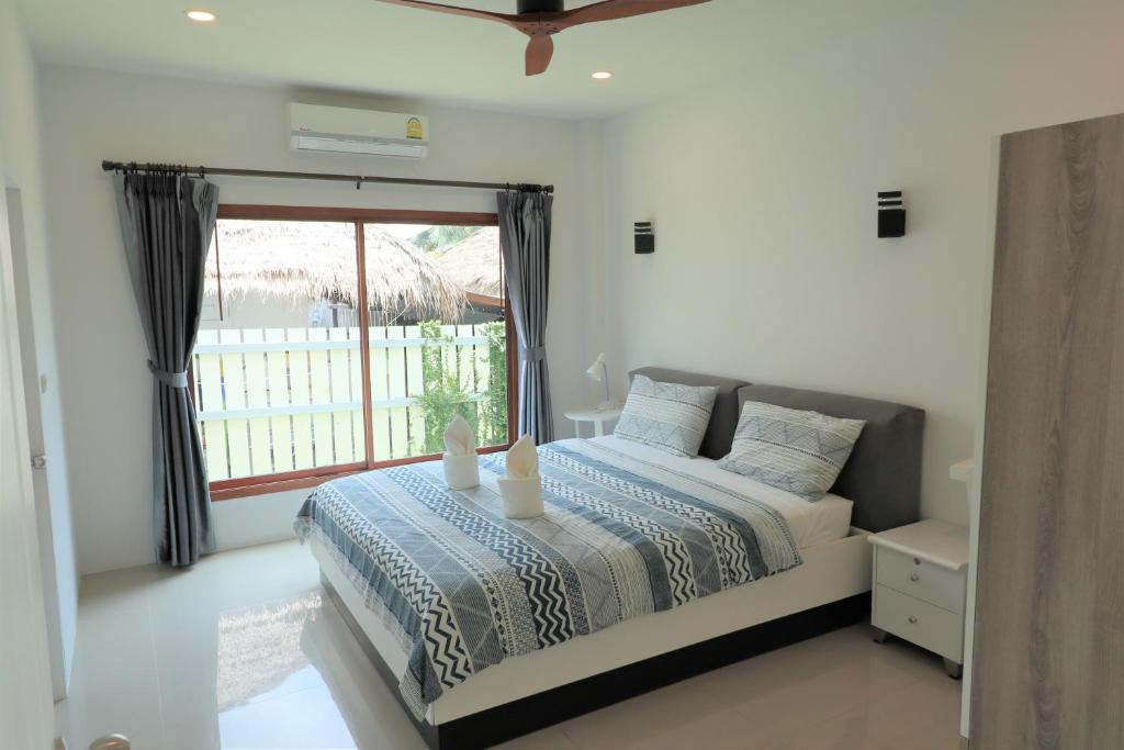 Postel nebo postele na pokoji v ubytování Koh Chang Villa