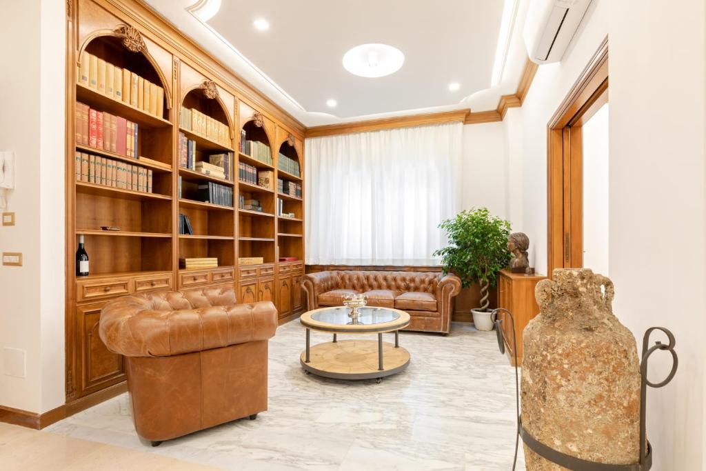 a living room with a couch and a table at First Class Rome Apartments in Rome