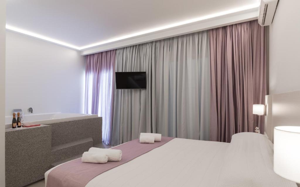 Postel nebo postele na pokoji v ubytování Poseidonio Hotel