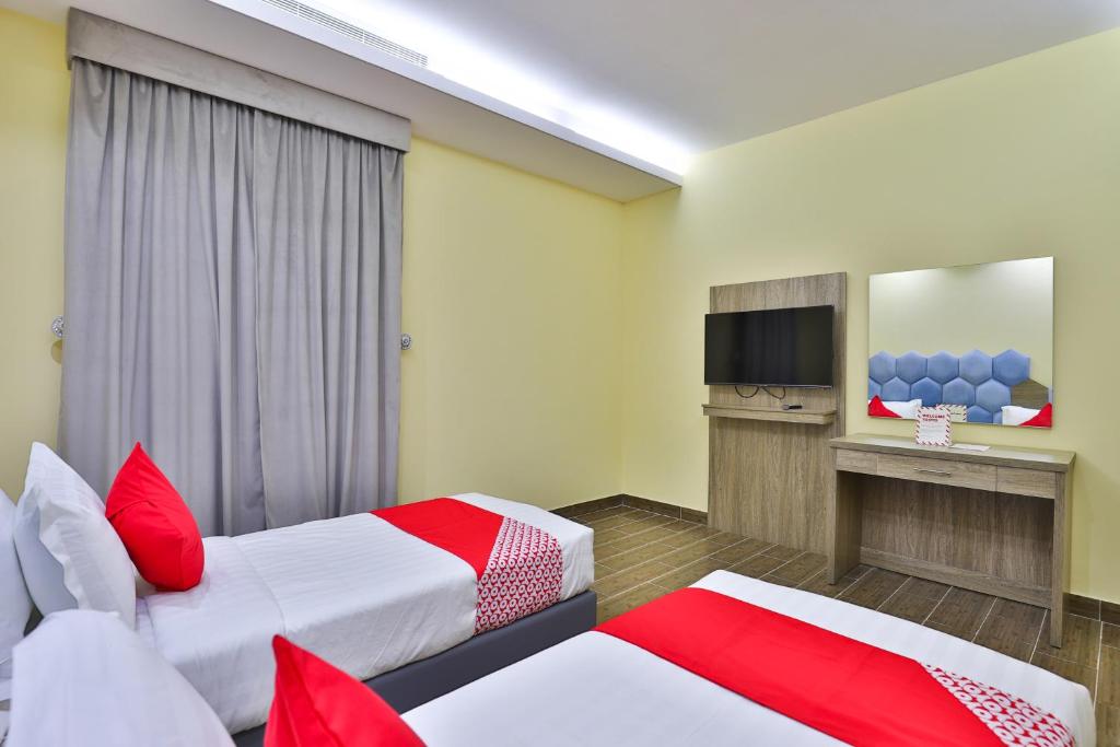Postel nebo postele na pokoji v ubytování Shahad Alola Serviced apartments