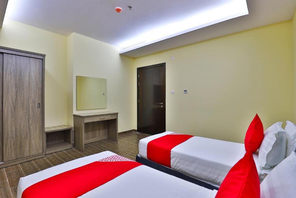 Postel nebo postele na pokoji v ubytování Shahad Alola Serviced apartments