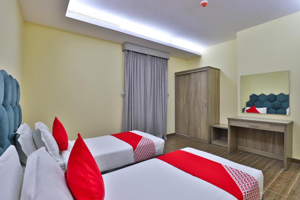 Postel nebo postele na pokoji v ubytování Shahad Alola Serviced apartments