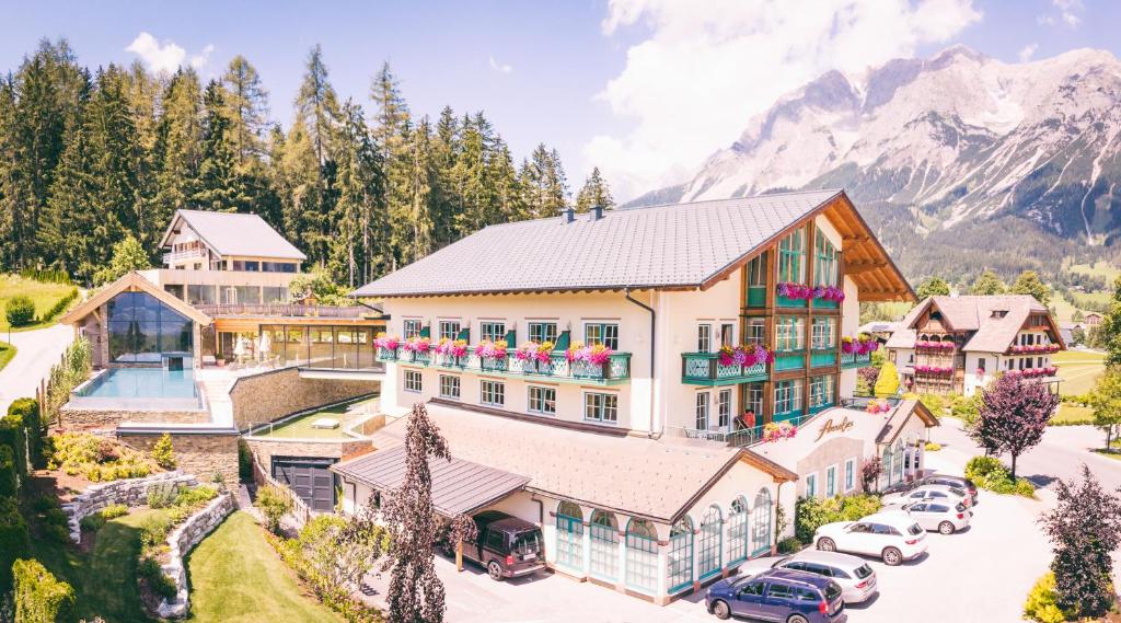 an aerial view of a house with a mountain at Hotel Annelies in Ramsau am Dachstein