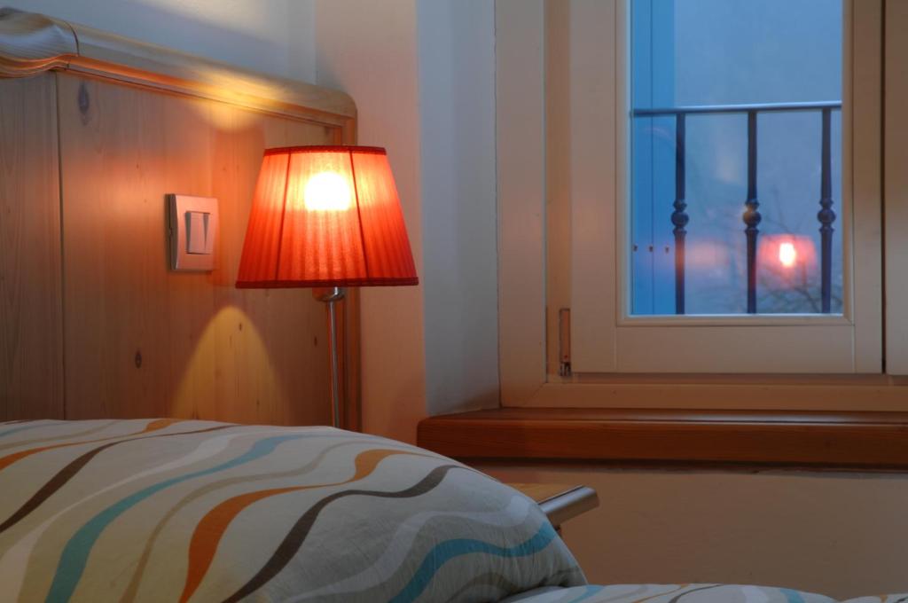 Postel nebo postele na pokoji v ubytování Albergo Parigi