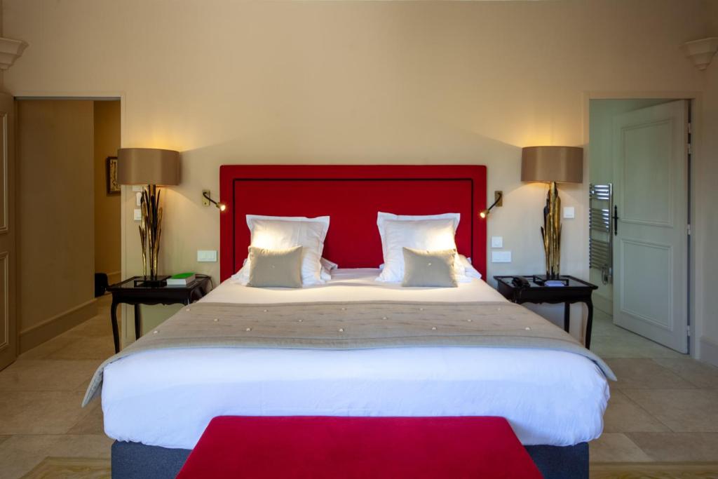 Postel nebo postele na pokoji v ubytování Le Phébus & Spa – Relais & Châteaux